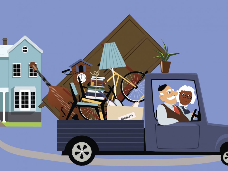 Senior couple moving their belongings from a big family house into a smaller home
