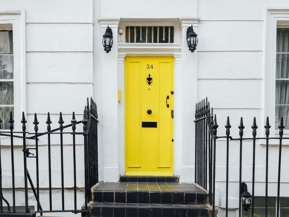 Front of a house with a yellow door