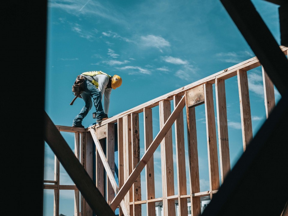 man working on a wooden construction