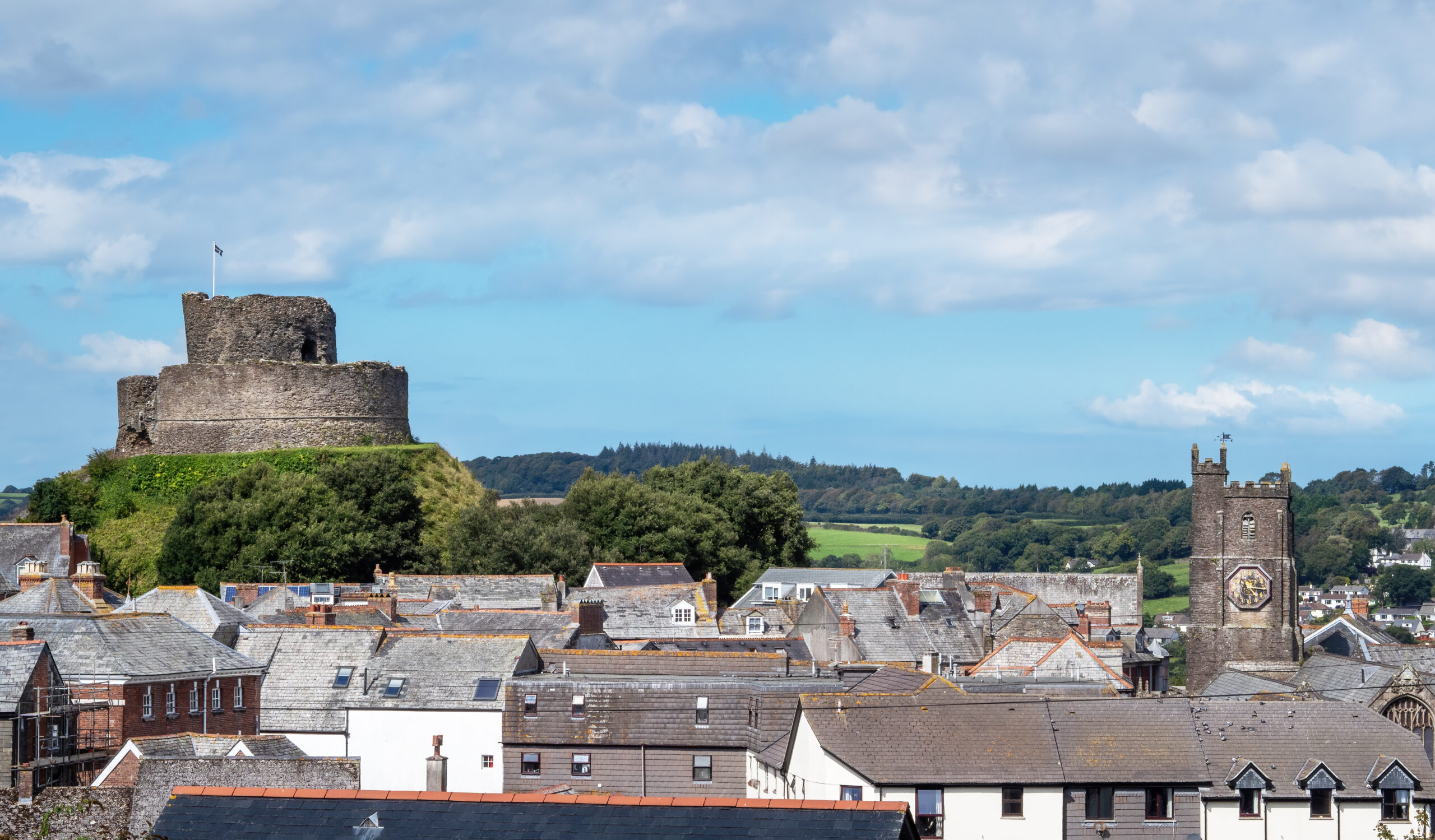 View over rooftops showing Parish Church and Castle, Launceston, Cornwall, UK